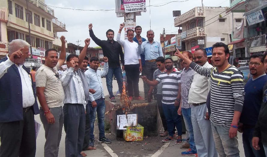Congressmen blow the effigy of central government