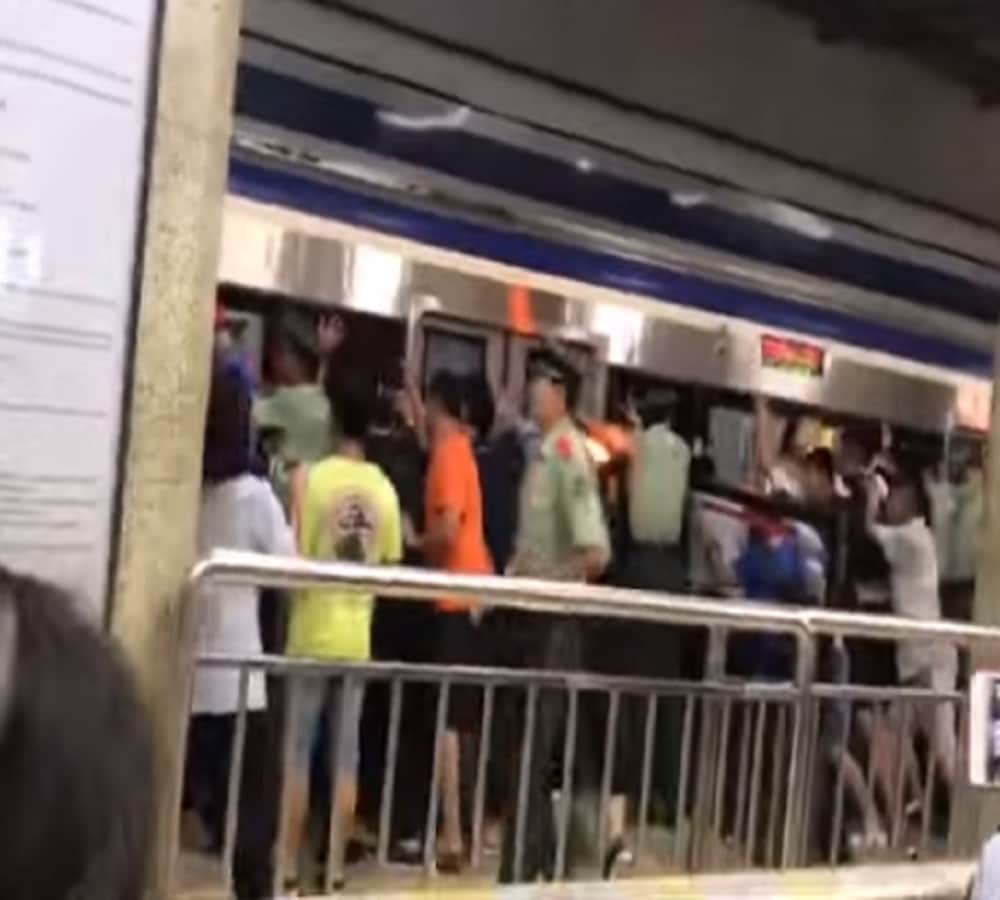 watch Viral Video of people pushing metro to rescue man stuck in platform gap in China