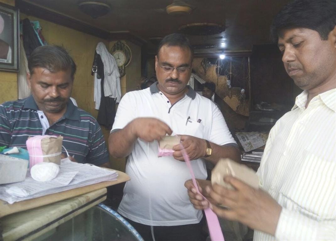Shopkeepers gathering fake pistachios in grove