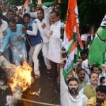 Congress activists demonstrate and protest against BJP in Lucknow.