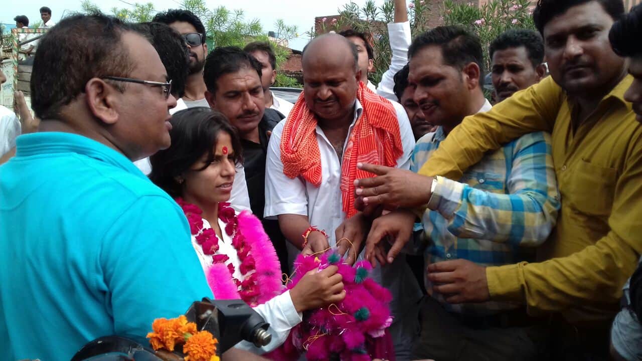 Indian woman cricket team member poonam yadav grand welcome in mainpuri 