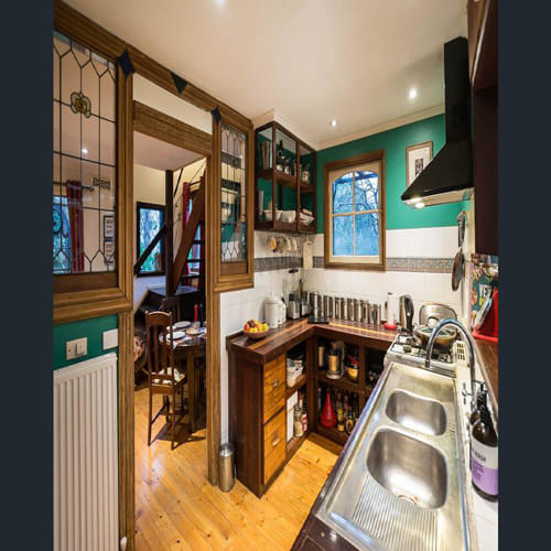 can you spot a child and dog in kitchen photo