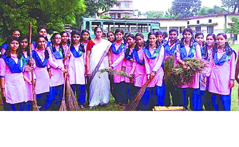 Schoolgirls cleaning in school premises