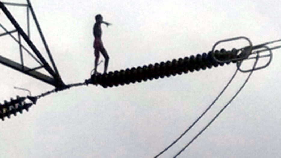 Young boy ascended at hightention line