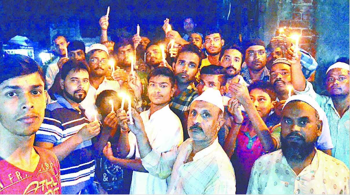Candles burn dead children present