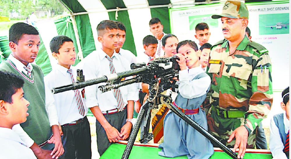 School children saw army's arms
