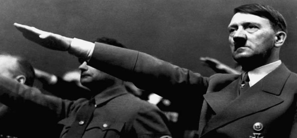 American man was punched by a passer-by as he gave the stiff-armed Nazi salute multiple times 
