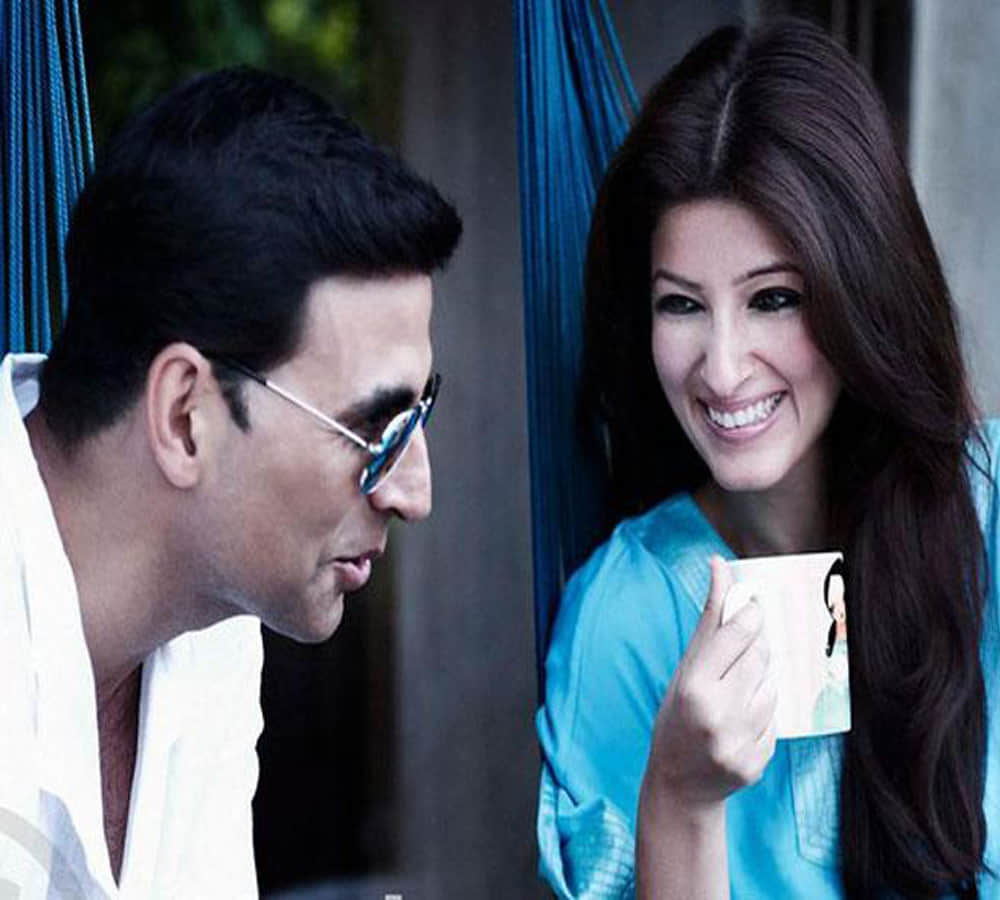 akshay and twinkle khanna wishing their fans merry christmas while dancing around the christmas tree