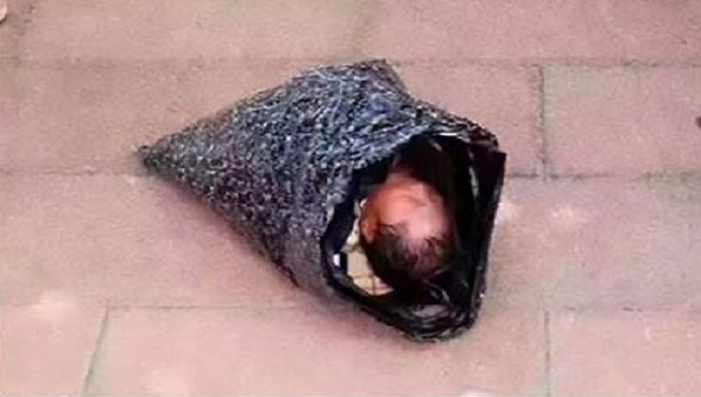 Newborn baby found on road side