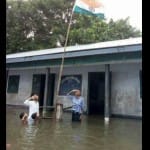 Assam schoolkids saluting the national flag by sinking into the water, photo viral