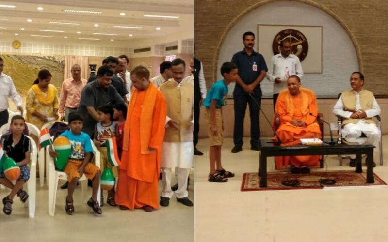 up cm yogi distributes books to orphan children