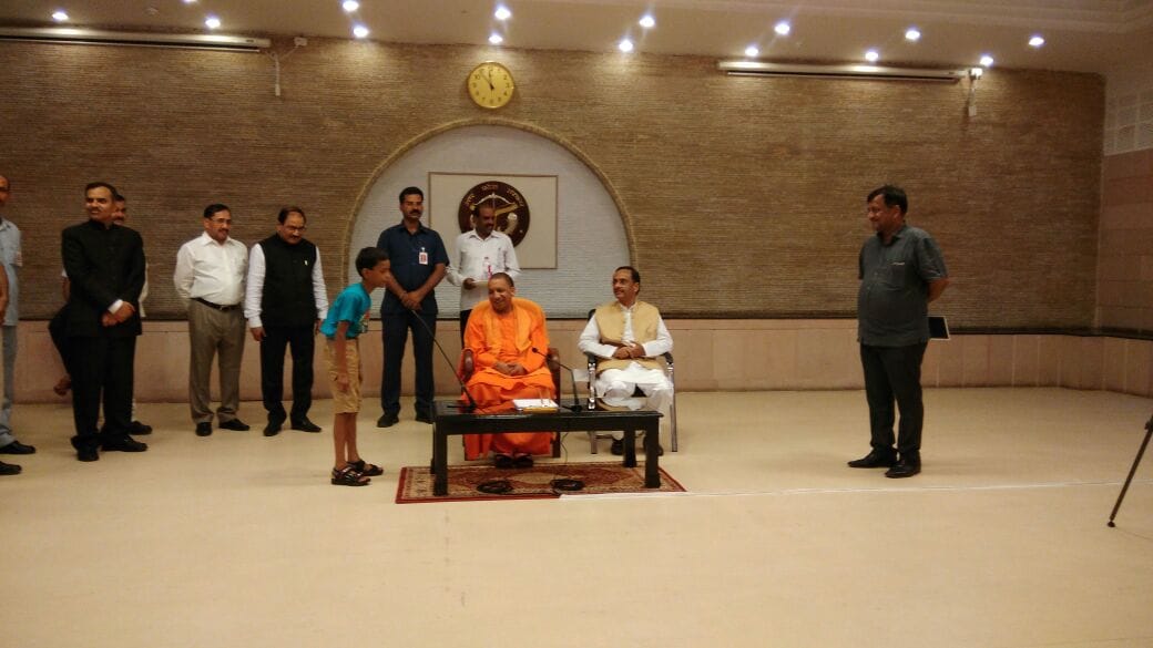 up cm yogi distributes books to orphan children