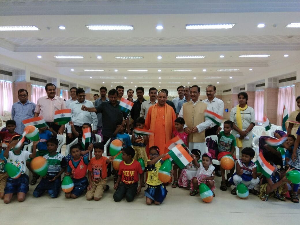 up cm yogi distributes books to orphan children