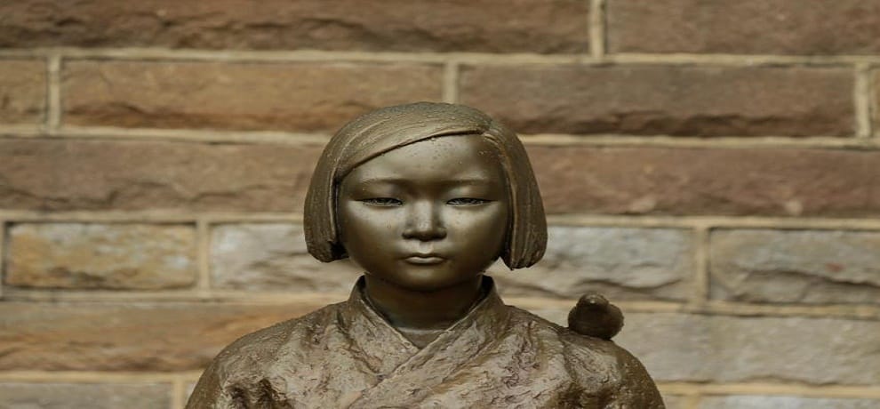 buses carry statue of comfert woman in south korea 