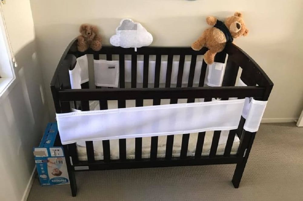 Spot the snake crawling near baby cot in this picture