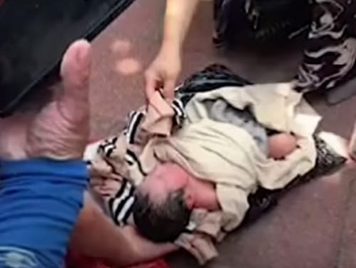 mother couriers her newly born baby in China