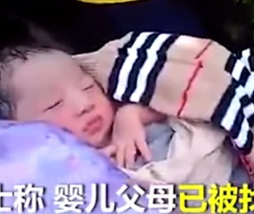 mother couriers her newly born baby in China