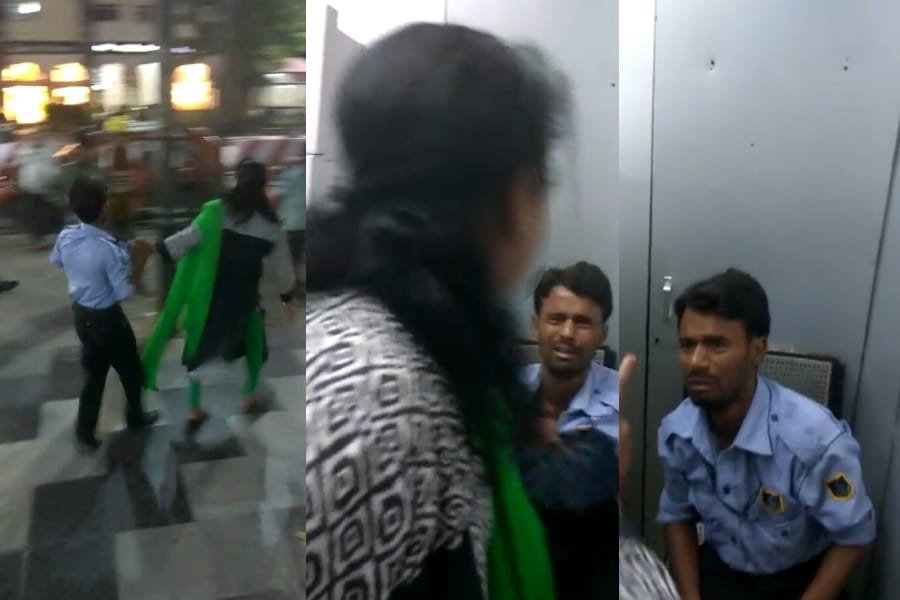 Women beats an ATM guard for making their videos.
