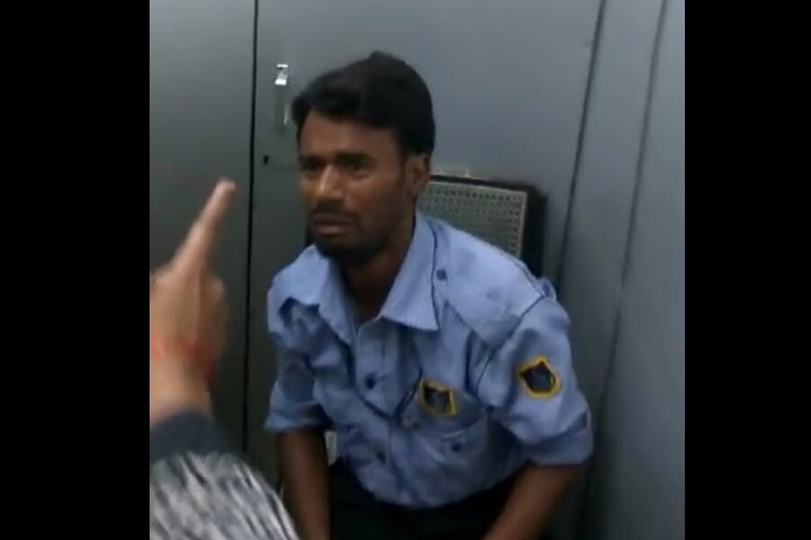 Women beats an ATM guard for making their videos.