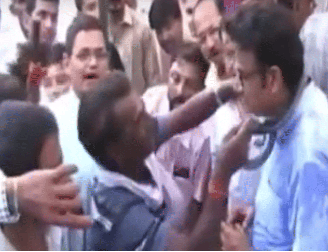 Snake trapped in minister's neck