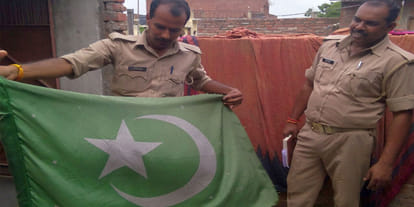 Pakistan flag fly on Kanpur womans terrace