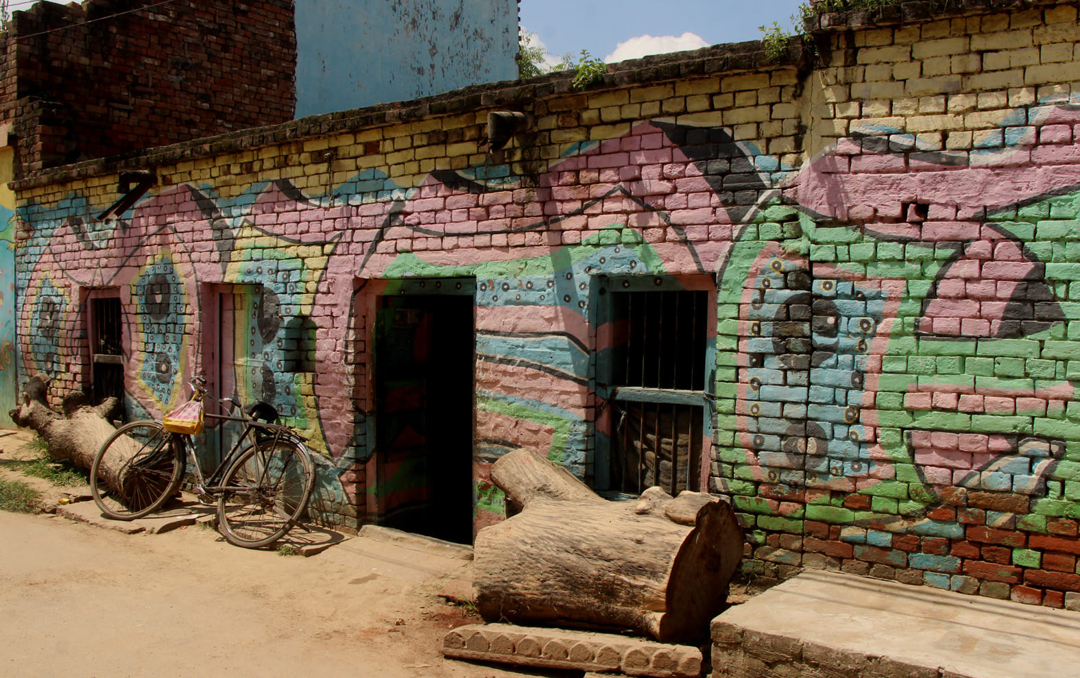 see the photos of varanasi village house fish painting