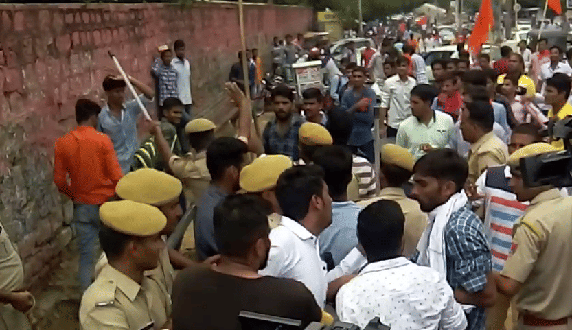 Students stuck with sticks in their hands, former student leader injured
