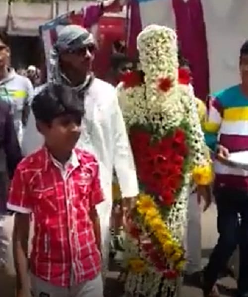 groom with full flower dress  you can not stop laughing