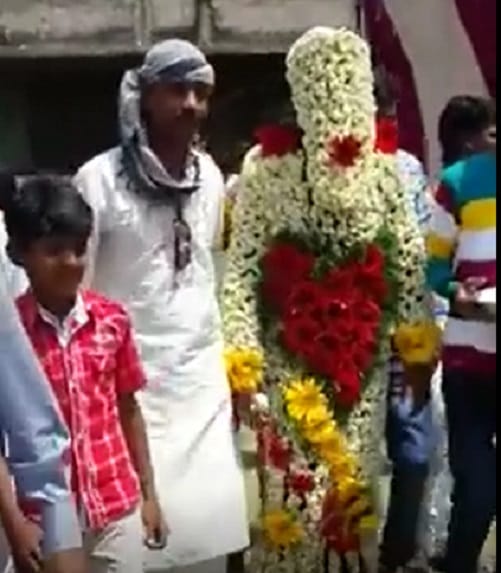 groom with full flower dress  you can not stop laughing