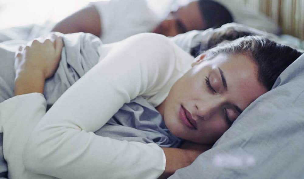 sleeping position with partner reveal your romantic relationship