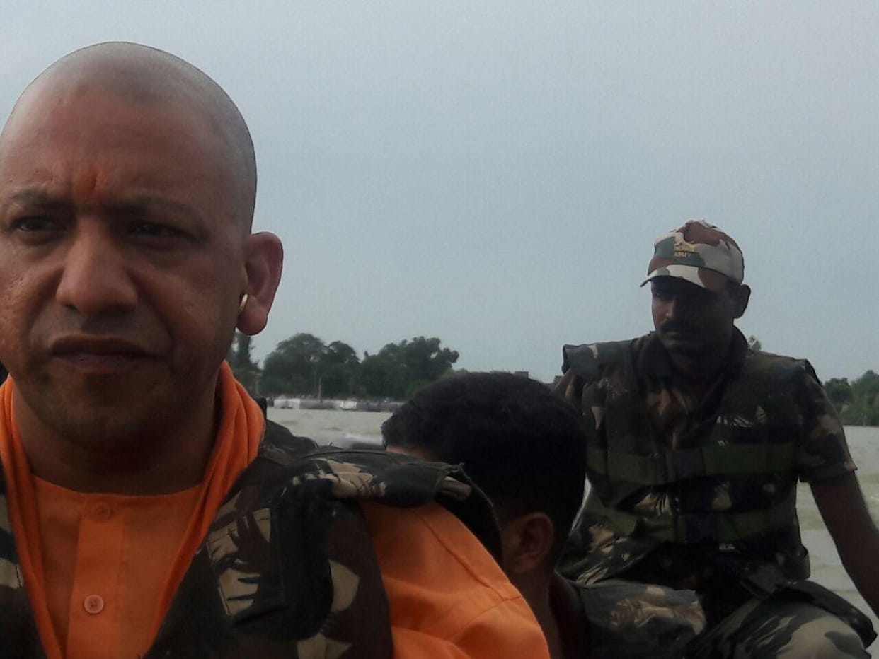yogi government to give four lakh rupees to families who lost their kin in flood.