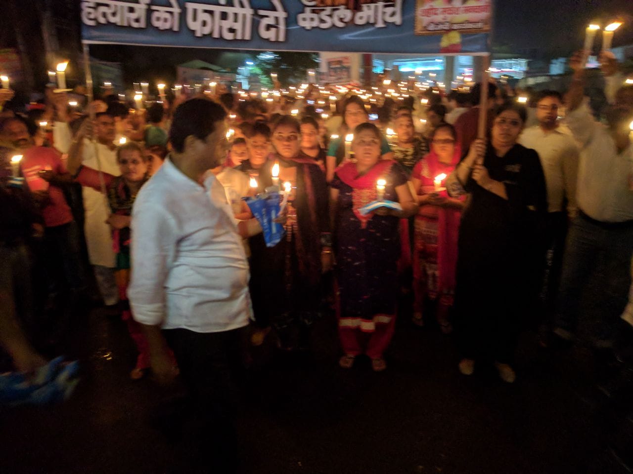 Candle march of sindhi community in Lucknow for action against murderer of businessman.