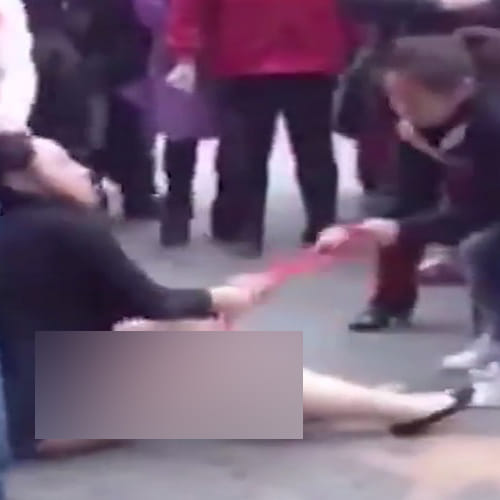 a women beaten by wife of the man in China street