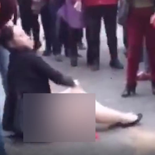 a women beaten by wife of the man in China street