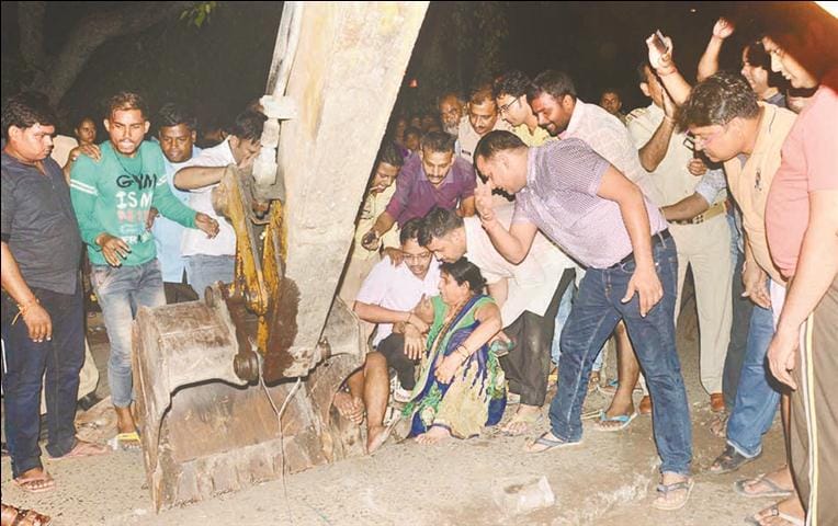 Woman's foot trapped in a bridge