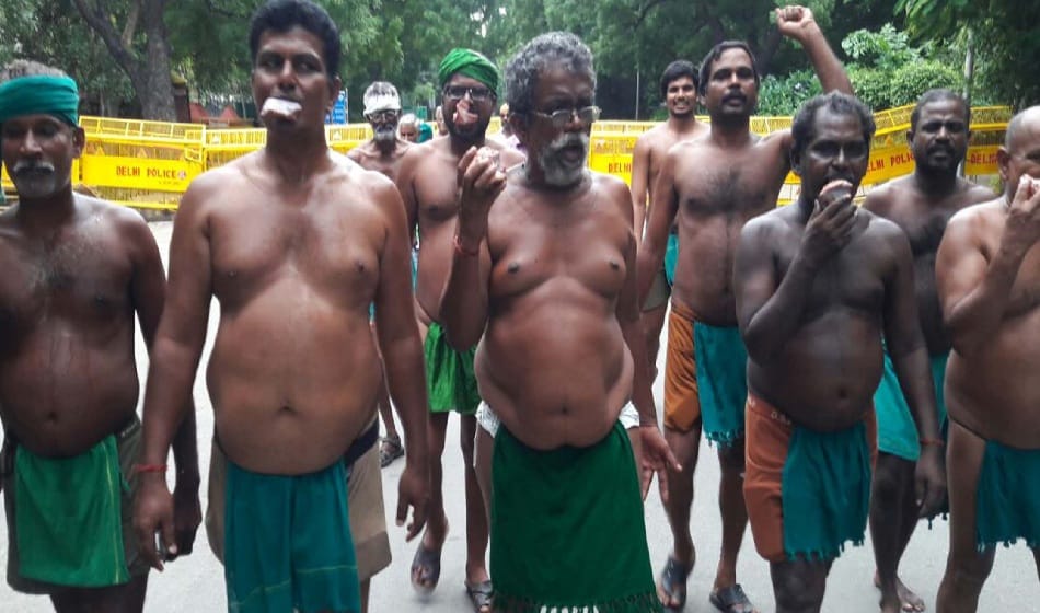 Tamil Nadu farmers protest by eating beef at jantar mantar on tuesday over drought relief funds  