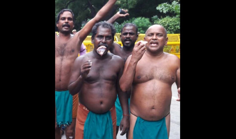 Tamil Nadu farmers protest by eating beef at jantar mantar on tuesday over drought relief funds  