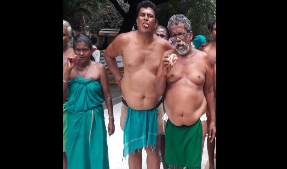 Tamil Nadu farmers protest by eating beef at jantar mantar on tuesday over drought relief funds  