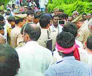People demonstrate with body of the villager