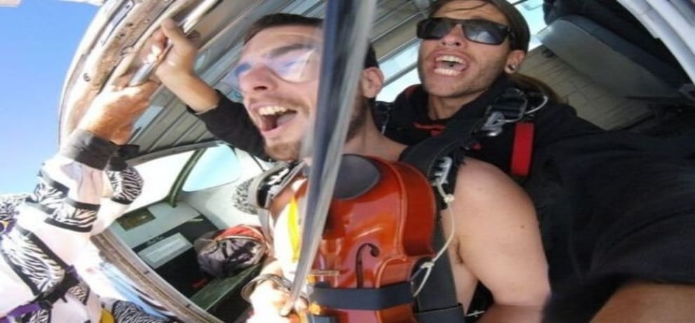 nude man jumped the airplane by playing violin 
