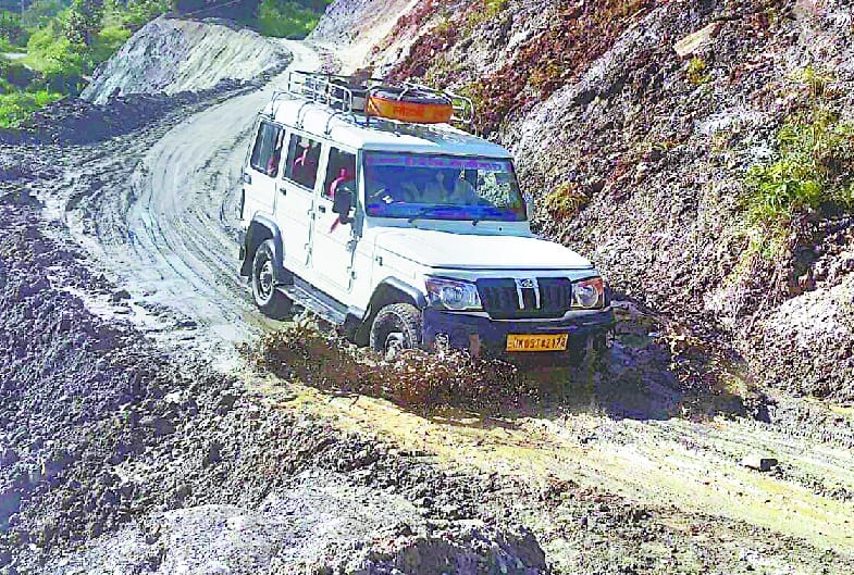 Motor vehicles stuck in mud in raateegaad