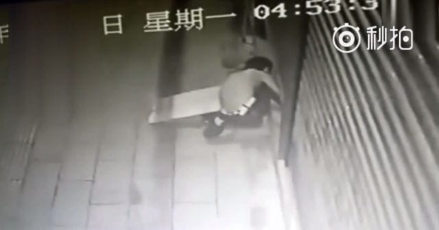 Thief Gets Foot Stuck In shutter Waits awkwardly for police rescue