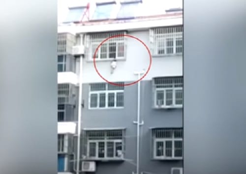Watch how neighbour save three year old girl By dangling from 4th floor of the   building