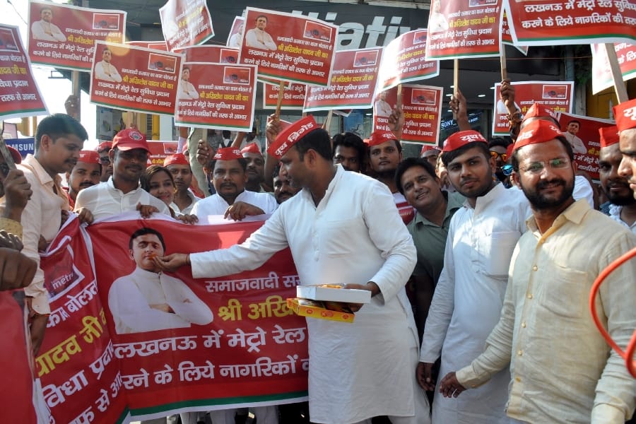 SP activists celebrate on metro stations in Lucknow.