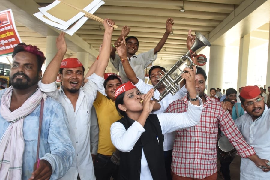 SP activists celebrate on metro stations in Lucknow.