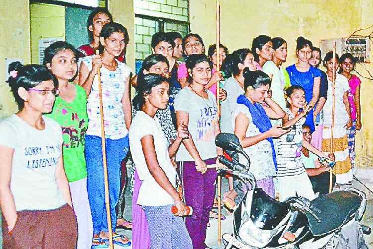 Students looking at unknown young people