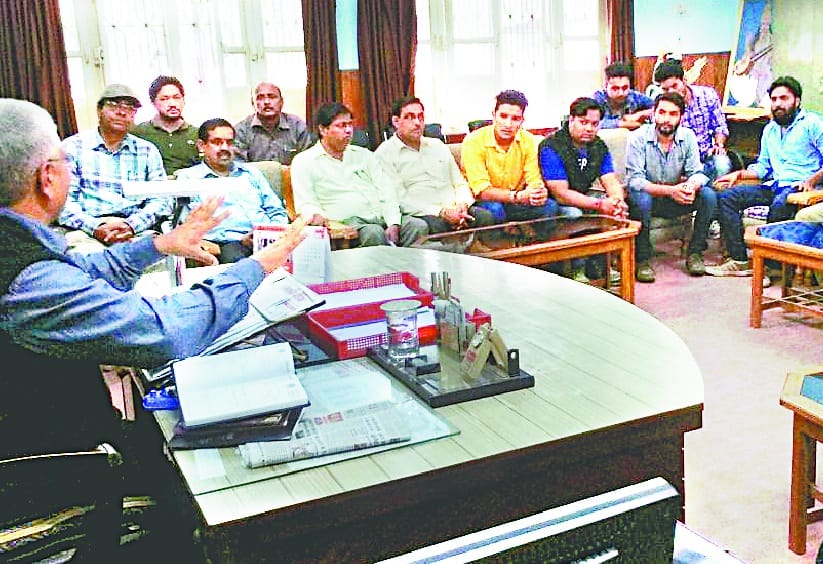Students group in PG College about effigies of effigy