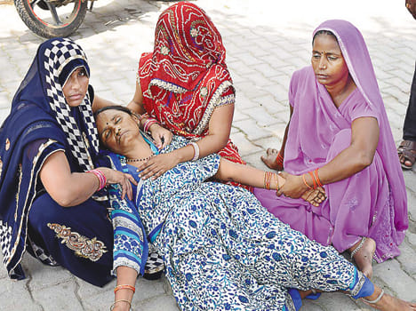 Father killed by collision with loader, injured two sons