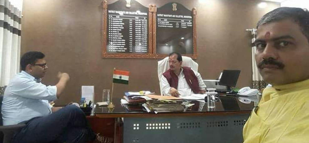 BJP leader vijay kumar sinha comes and sits on DM seat in bihar