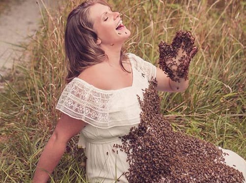 Pregnant mother weird maternity photo shoot with honey bees
